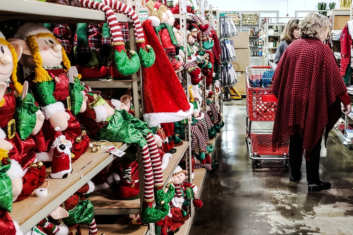 Christmas shopping aisle with festive decorations.