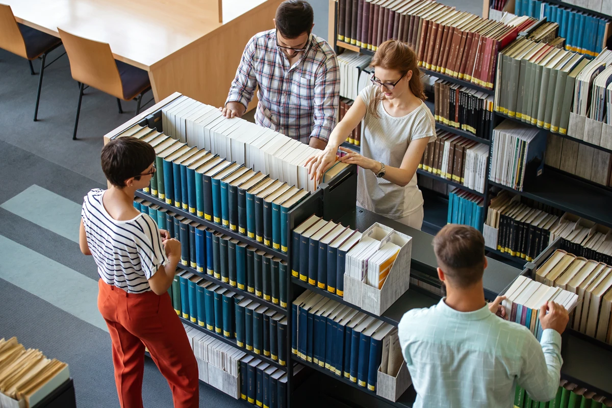 People browsing books in a modern library.