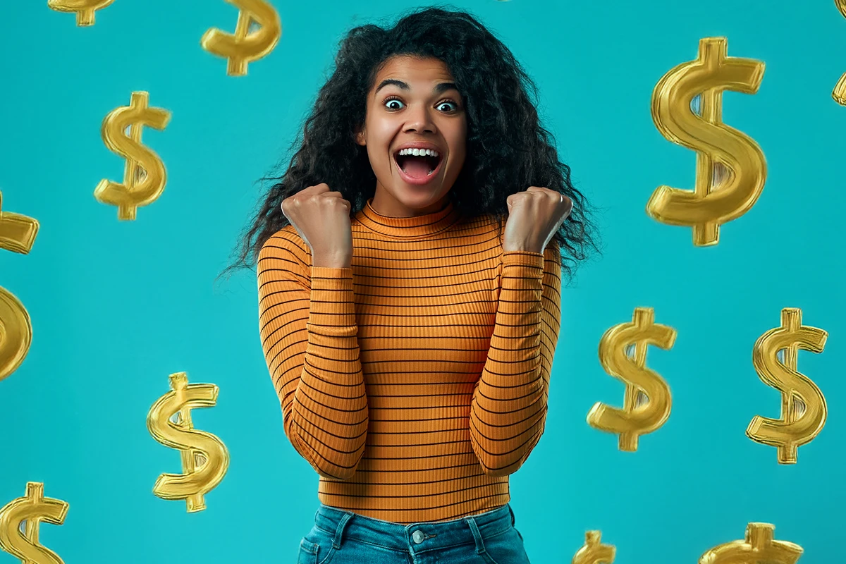 Excited woman with floating golden dollar signs