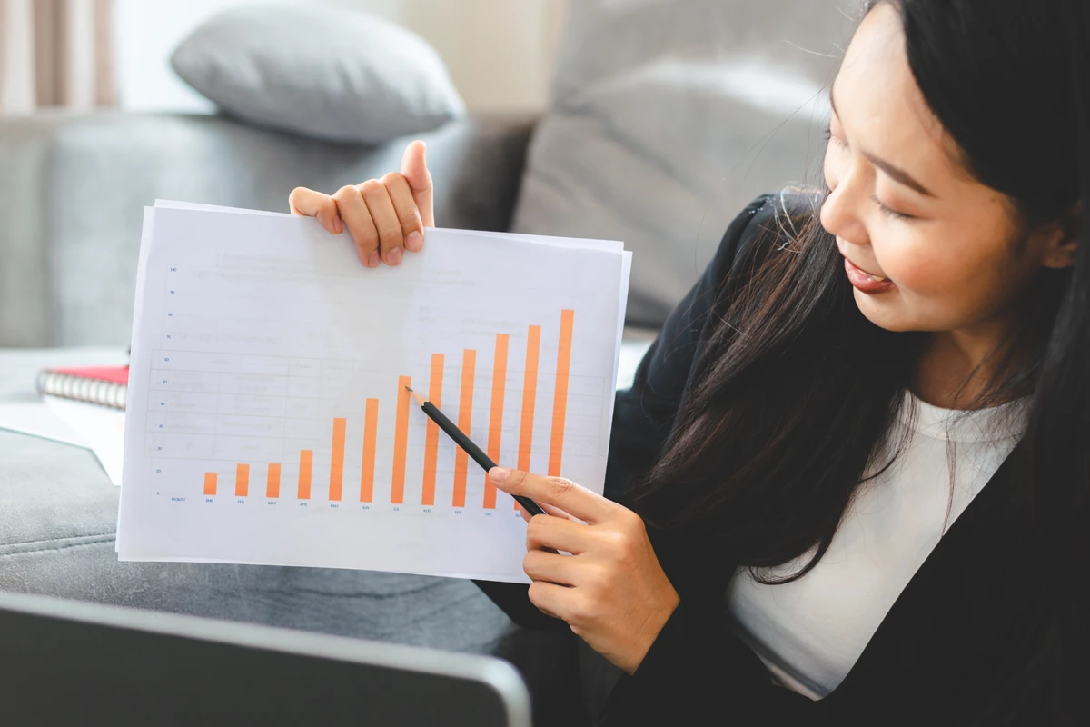 Woman reviewing financial growth chart