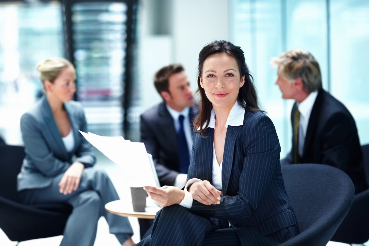 Businesswoman with documents in modern office meeting