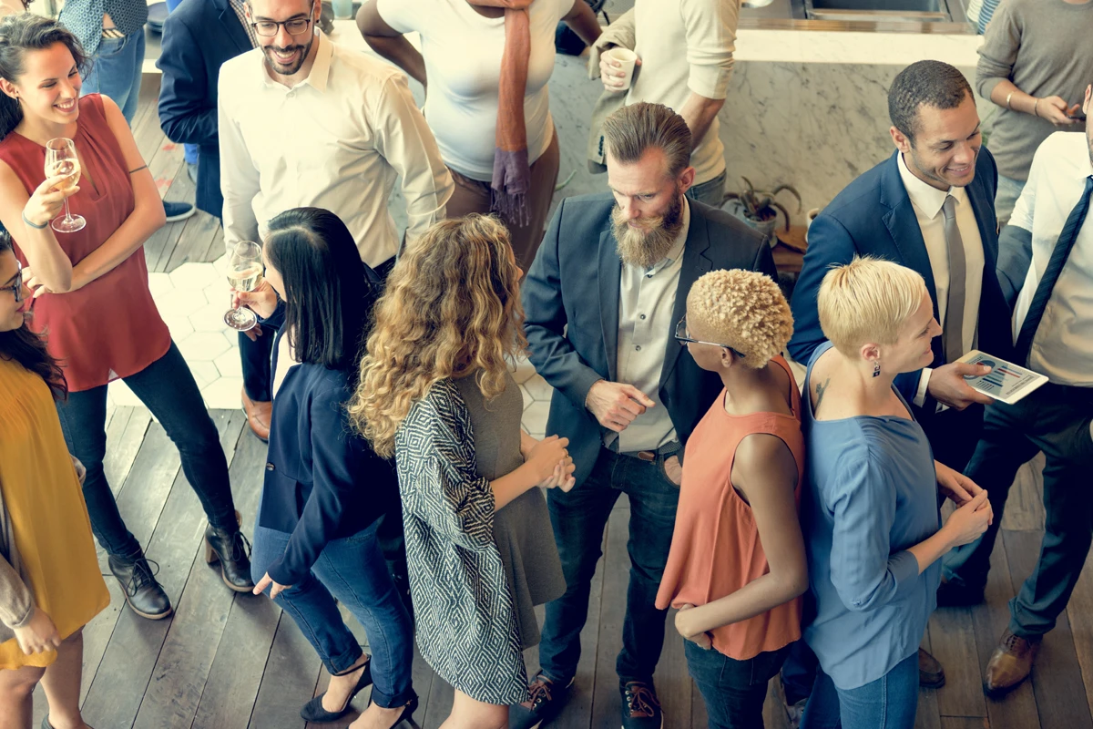 Diverse group networking at casual business event