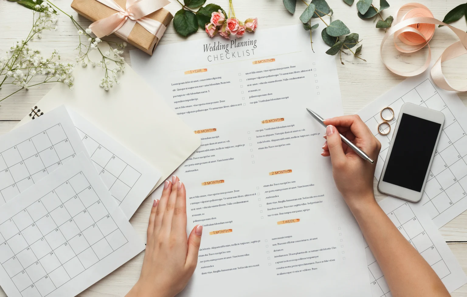 Person planning wedding with checklist and calendar