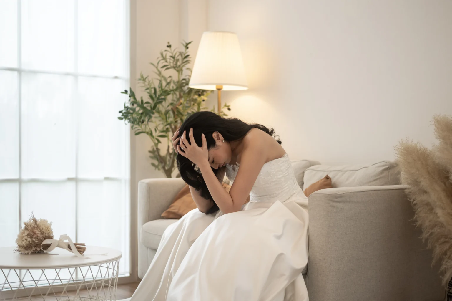 Bride in emotional embrace on wedding day indoors