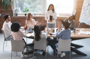 Diverse team in a meeting with enthusiastic applause