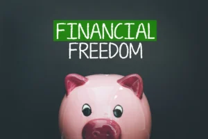 Pink piggy bank under 'Financial Freedom' text.