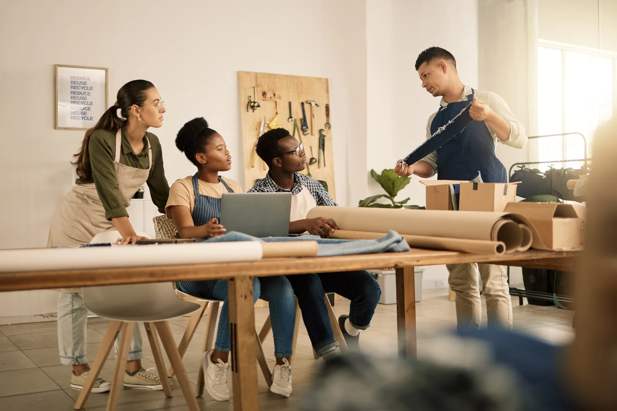 Diverse team collaborating in a workshop environment