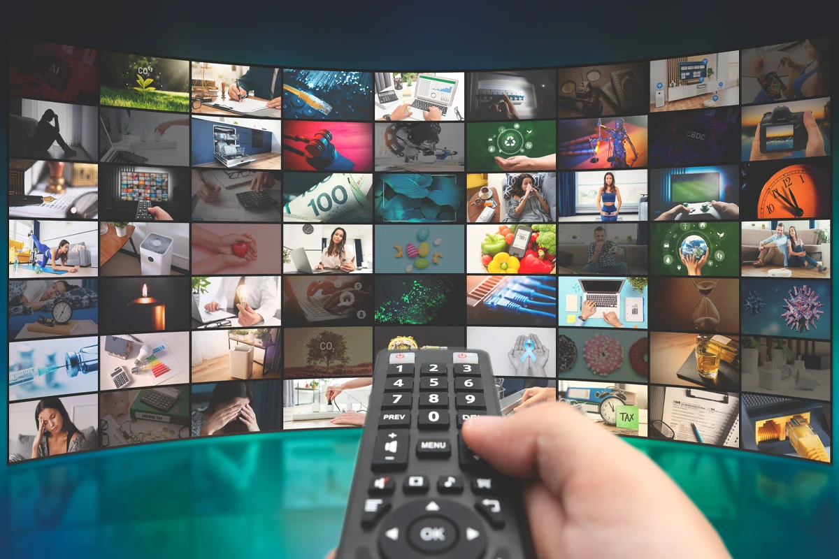a hand holding a remote control