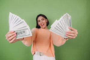 a woman holding money in her hands